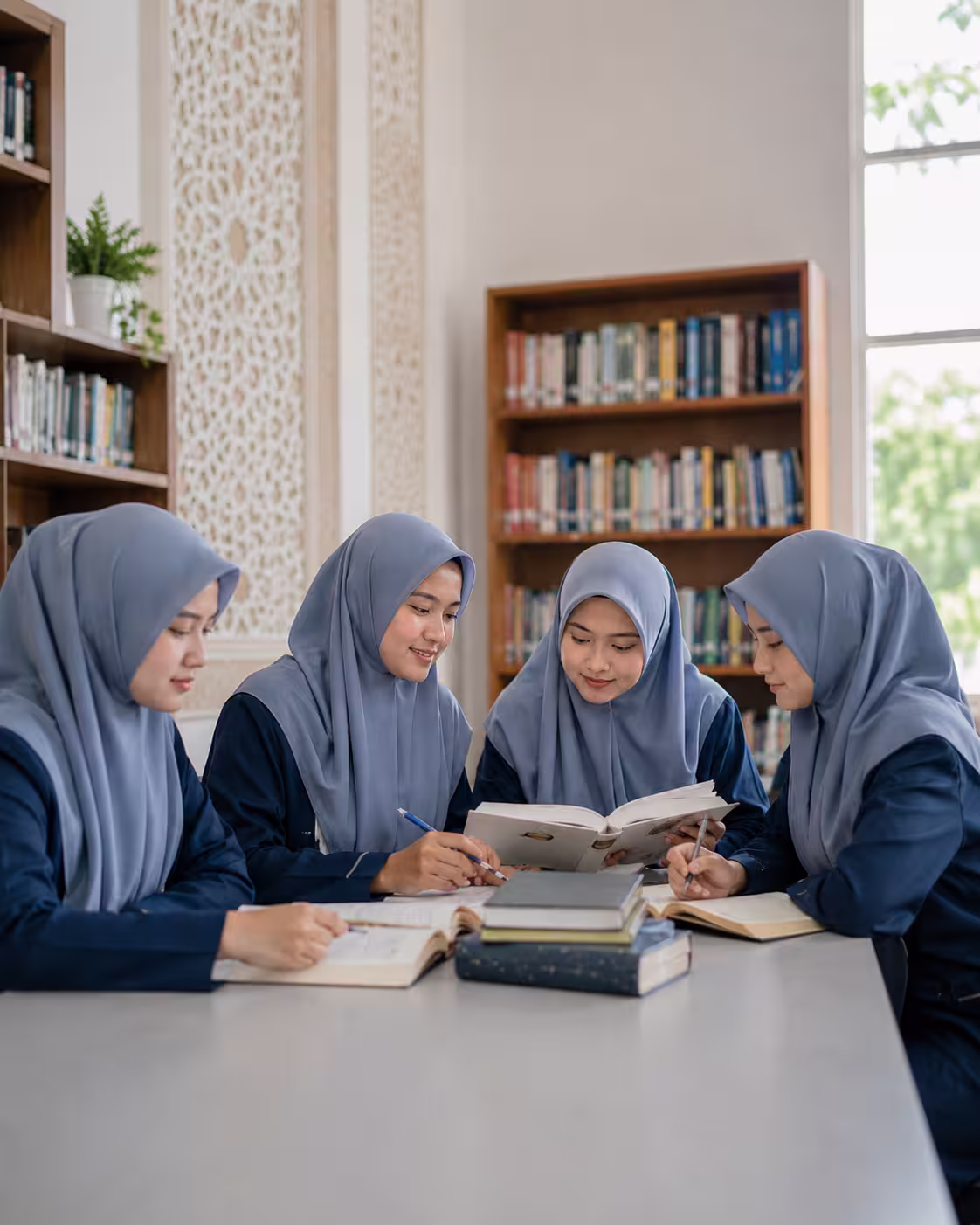 Female students studying in an Islamic learning environment